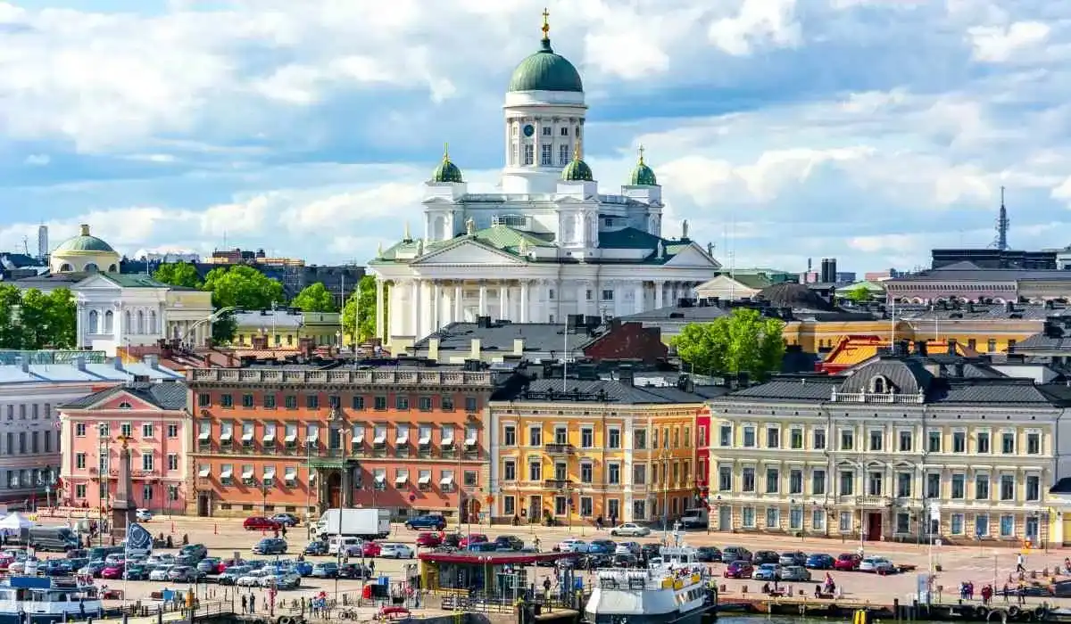Helsinki Cathedral and colorful old town buildings in Helsinki, Finland, under bright summer skies