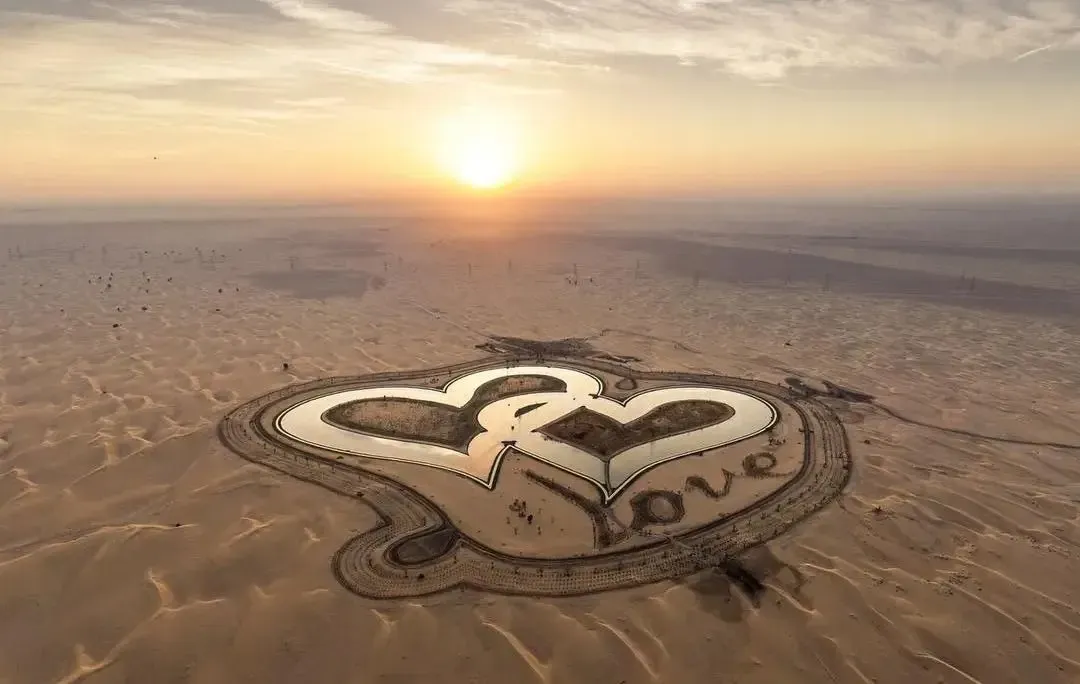 Aerial view of Love Lake Dubai in the shape of two hearts at sunset