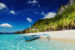 Traditional boat on White Beach Boracay with turquoise water and palm trees Philippines